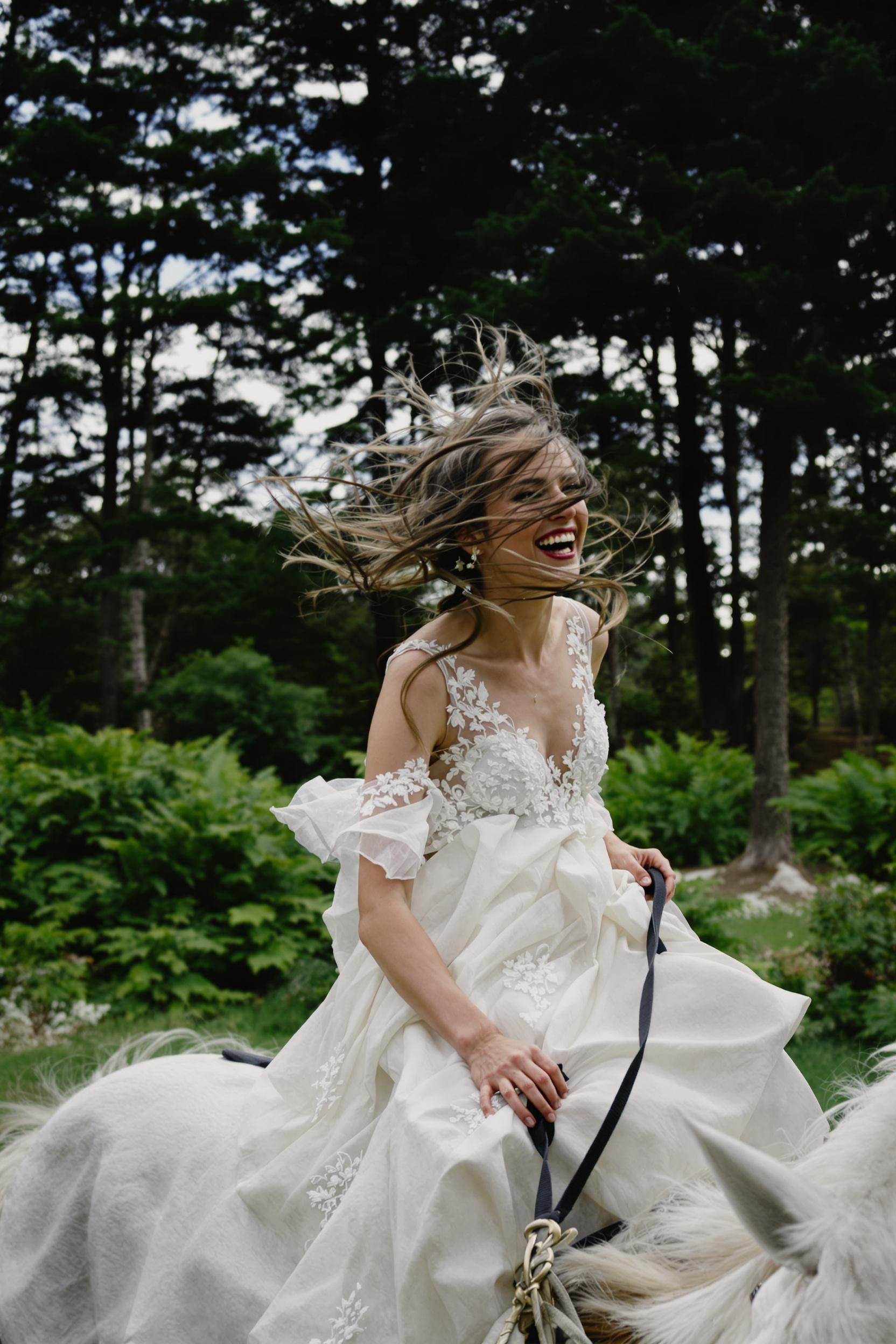 A Beautiful Bride In Her Wedding Dress Rides On The Back Of An All-white Horse Through New Zeala