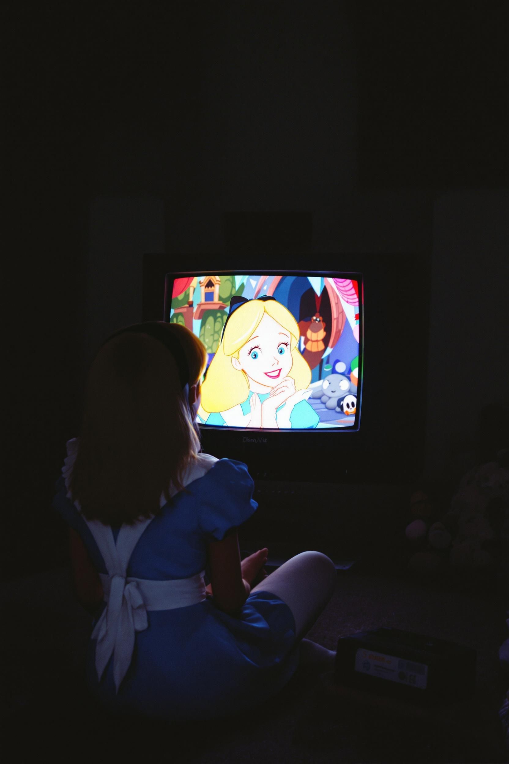Grungy Analog Photo Of Alice (from Alice In Wonderland) Watching Her Own Movie On A 90s CRT TV I