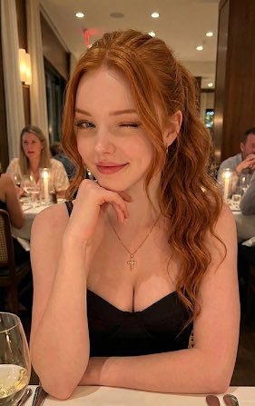 Charming Redhead Winking In Restaurant