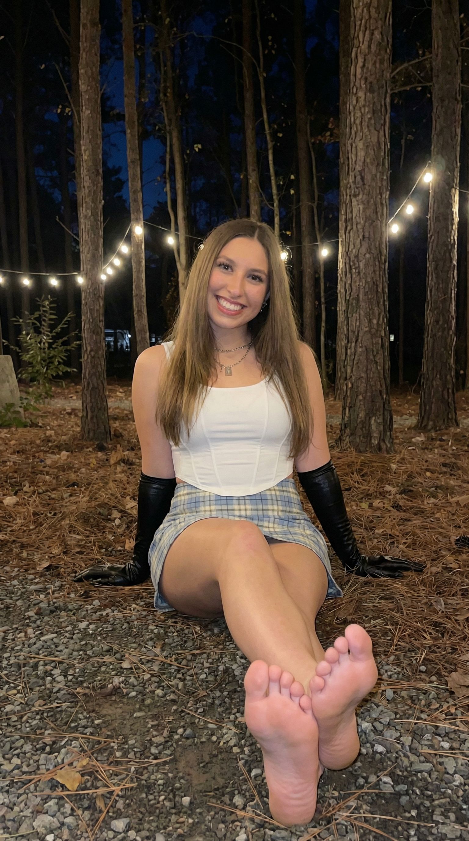 Nano Banana prompt: Use this girl and make her sitting down with her bare feet and soles showing in ...
