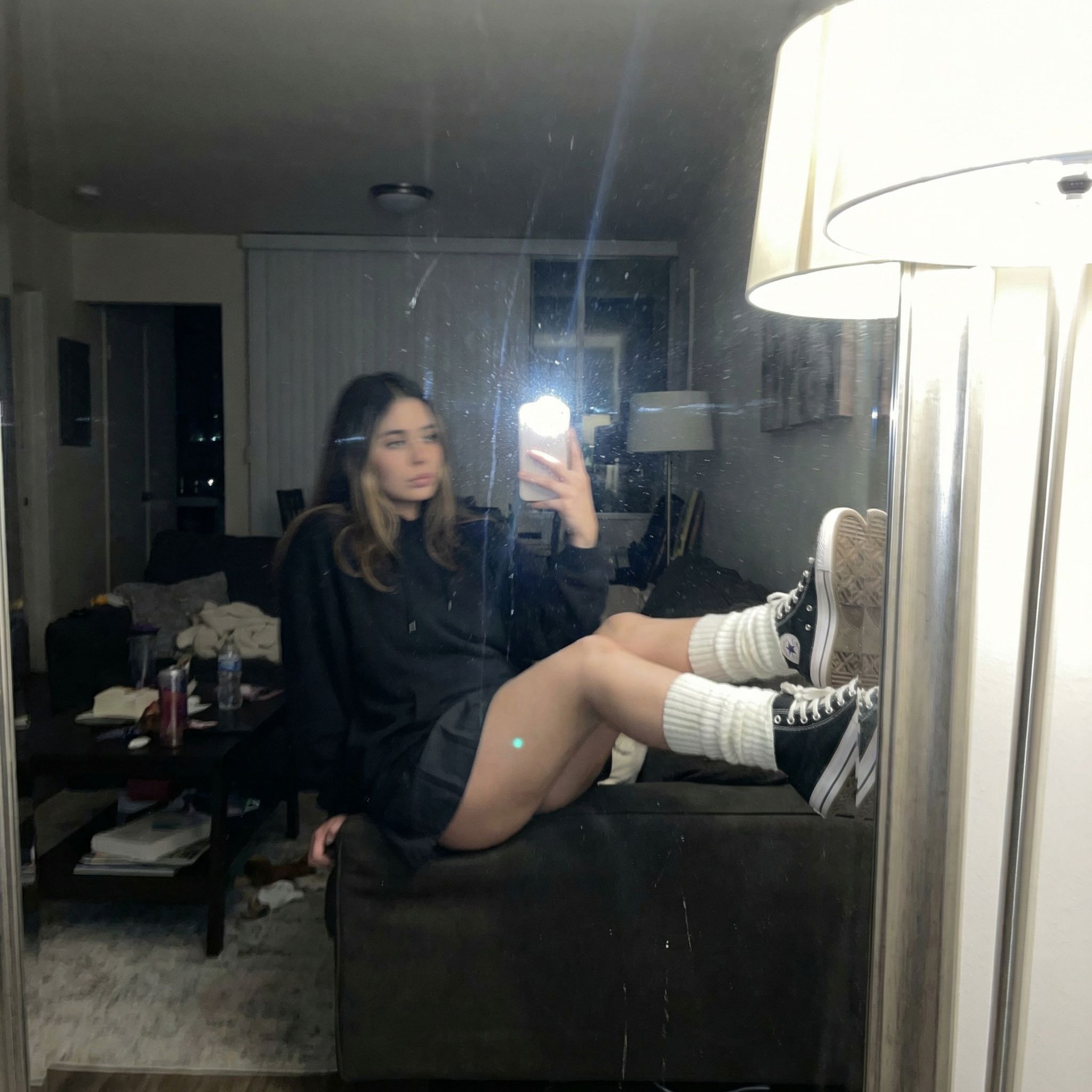 Nano Banana prompt: An extremely unremarkable iPhone mirror selfie photo with no clear subject or fr...